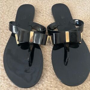 Michael Kors Black and Gold Bow Sandals